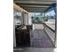 Inviting covered porch with bench seating and outdoor rug at 2011 N 26Th Cir, Mesa, AZ 85213