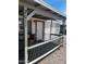 Charming front porch with bench seating and decorative railing at 2011 N 26Th Cir, Mesa, AZ 85213