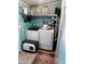 Well-equipped laundry room with washer, dryer, shelving, and storage at 2011 N 26Th Cir, Mesa, AZ 85213