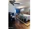 Spacious open-concept living room with TV, comfortable seating and ceiling fans at 2011 N 26Th Cir, Mesa, AZ 85213