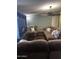 Spacious living room with comfortable seating, a ceiling fan, and media center at 2011 N 26Th Cir, Mesa, AZ 85213