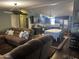 An open-concept living area includes an eat-in kitchen and comfortable seating at 2011 N 26Th Cir, Mesa, AZ 85213