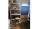 An organized room with a shelf, boxes and a stool with a yellow seat at 2011 N 26Th Cir, Mesa, AZ 85213