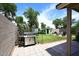 Landscaped backyard featuring a grill, shed and seating area at 2727 S 160 Ln, Goodyear, AZ 85338