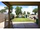 Spacious backyard featuring a lush lawn, shed, and sitting area at 2727 S 160 Ln, Goodyear, AZ 85338