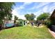 Landscaped backyard featuring a shed, landscaping, and fire pit at 2727 S 160 Ln, Goodyear, AZ 85338