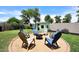 Inviting backyard features a cozy fire pit area, playhouse and is perfect for outdoor entertaining at 2727 S 160 Ln, Goodyear, AZ 85338