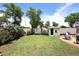 Manicured backyard featuring a shed, landscaping, and sitting area at 2727 S 160 Ln, Goodyear, AZ 85338