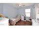 Cozy bedroom with natural light and wood flooring at 2727 S 160 Ln, Goodyear, AZ 85338