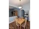 Open concept dining room with wood floors and modern lighting at 2727 S 160 Ln, Goodyear, AZ 85338