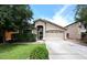 Charming single-story home with well-manicured lawn, mature landscaping, and inviting two-car garage at 2727 S 160 Ln, Goodyear, AZ 85338