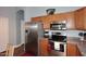Well lit kitchen with stainless steel appliances and oak cabinets at 2727 S 160 Ln, Goodyear, AZ 85338