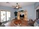Bright living room with ceiling fan, wood floors, and sliding glass doors to patio at 2727 S 160 Ln, Goodyear, AZ 85338