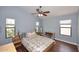 Spacious bedroom with hardwood floors and large windows allowing natural light at 2727 S 160 Ln, Goodyear, AZ 85338