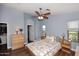 Bright bedroom with hardwood floors and natural light from multiple windows at 2727 S 160 Ln, Goodyear, AZ 85338