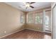 Bedroom with light wood flooring and windows, providing a bright and airy atmosphere at 2854 N Claire Dr, Buckeye, AZ 85396
