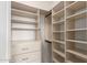 Walk-in closet featuring custom shelving and ample storage space, perfect for organization at 2854 N Claire Dr, Buckeye, AZ 85396