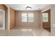 Bright dining area with two large windows and tile flooring at 2854 N Claire Dr, Buckeye, AZ 85396