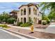 A two-story home with arches, balconies, and verdant landscaping at 2854 N Claire Dr, Buckeye, AZ 85396