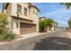 Two-story home with brown garage door and desert landscaping at 2854 N Claire Dr, Buckeye, AZ 85396