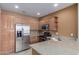 Well-equipped kitchen features stainless steel appliances and light wood cabinets at 2854 N Claire Dr, Buckeye, AZ 85396