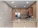 Well-equipped kitchen features stainless steel appliances and light wood cabinets at 2854 N Claire Dr, Buckeye, AZ 85396