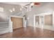 Spacious living room featuring staircase, and views into the kitchen area at 2854 N Claire Dr, Buckeye, AZ 85396