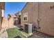 A backyard includes an AC unit, brick trim, small patch of grass, and rock ground cover at 2862 E Megan St, Gilbert, AZ 85295