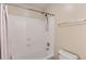 This bathroom shows a shower and tub combo with shower curtain, toilet, and light walls at 2862 E Megan St, Gilbert, AZ 85295