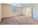 Empty bedroom featuring carpet flooring, a ceiling fan, and natural light from the window at 2862 E Megan St, Gilbert, AZ 85295