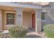 Covered front porch with neutral decor, brick pavers and well manicured landscaping at 2862 E Megan St, Gilbert, AZ 85295