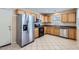 Functional kitchen features stainless steel appliances and wood cabinets at 2862 E Megan St, Gilbert, AZ 85295
