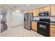 Bright kitchen features stainless steel appliances, tile flooring, and ample storage at 2862 E Megan St, Gilbert, AZ 85295