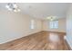 Large living area featuring hardwood floors, a ceiling fan and bright natural light at 2862 E Megan St, Gilbert, AZ 85295