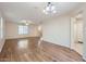 Expansive living room with wood floors, ceiling fan and neutral paint at 2862 E Megan St, Gilbert, AZ 85295