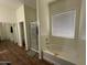 Bright bathroom featuring a bathtub, shower, and closet with mirrored doors at 2981 S 257Th Ave, Buckeye, AZ 85326