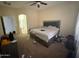 Bedroom featuring a bed, carpet, and a ceiling fan at 2981 S 257Th Ave, Buckeye, AZ 85326