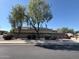 Charming single-story home with well-manicured landscaping, mature trees, and a privacy wall at 2981 S 257Th Ave, Buckeye, AZ 85326