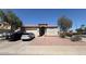 Single-story home with a two-car garage, complemented by desert landscaping at 2981 S 257Th Ave, Buckeye, AZ 85326