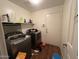 Functional laundry room with appliances, storage and a door at 2981 S 257Th Ave, Buckeye, AZ 85326