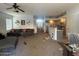Open-concept living area with a view of the kitchen and comfortable seating area at 2981 S 257Th Ave, Buckeye, AZ 85326