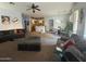 Spacious living room with plush sofas, carpet flooring, and an open layout at 2981 S 257Th Ave, Buckeye, AZ 85326