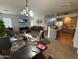 Expansive living room with large windows, ample seating, and seamless flow to the kitchen at 2981 S 257Th Ave, Buckeye, AZ 85326