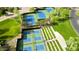 Aerial view of the community tennis and pickleball courts surrounded by mature landscaping at 31221 N 130Th Ln, Peoria, AZ 85383
