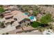 Aerial view of home with lush backyard, pool and desert landscaping at 31221 N 130Th Ln, Peoria, AZ 85383