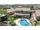 Aerial view of home with a pool, luscious backyard, and mountain views at 31221 N 130Th Ln, Peoria, AZ 85383