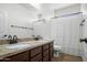 Bathroom features double sinks, a bathtub, and a separated toilet and shower area at 31221 N 130Th Ln, Peoria, AZ 85383