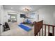 Upstairs bonus room with exercise equipment, ceiling fan, and carpet flooring at 31221 N 130Th Ln, Peoria, AZ 85383