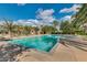 Community pool featuring ample seating and pristine, well-maintained desert landscaping at 31221 N 130Th Ln, Peoria, AZ 85383