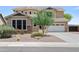 Charming single-Gathering home showcases desert landscaping with mature trees and a spacious driveway at 31221 N 130Th Ln, Peoria, AZ 85383